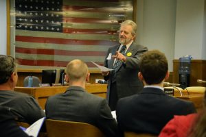 Photo by Doug Yarrow. Michael explains pending Wage Theft legislation in our 2015 advocacy day.